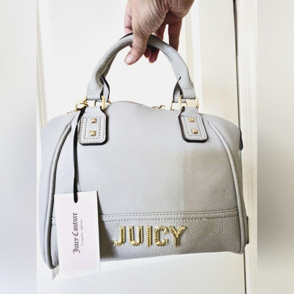 A lovely new Juicy Couture gray satchel in a small to medium size